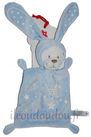 Doudou ours bleu et blanc déguisé en lapin phosphorescent Nicotoy