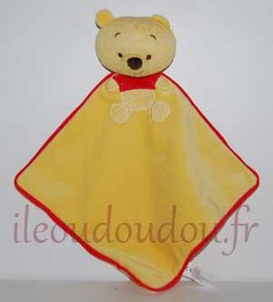 Doudou Winnie plat jaune et rouge, maille tricotée Disney Baby, Nicotoy, Simba Toys (Dickie)
