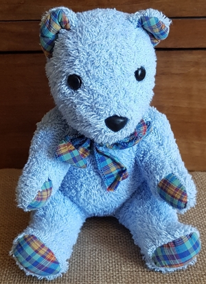 Ours en peluche bleu et à carreaux Nounours